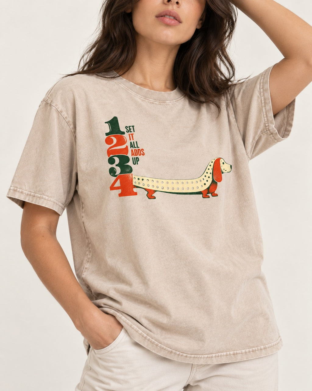 Dachshund Adds Up Washed Tee in Apricot, worn by a model, front view