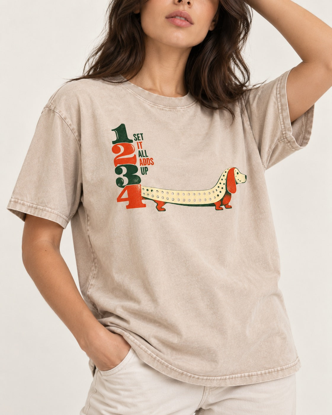 Dachshund Adds Up Washed Tee in Apricot, worn by a model, front view