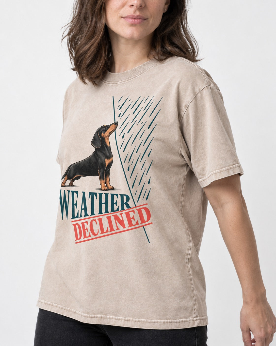 Weather Declined by Dachshund Washed Tee in Apricot, worn by a model, front view
