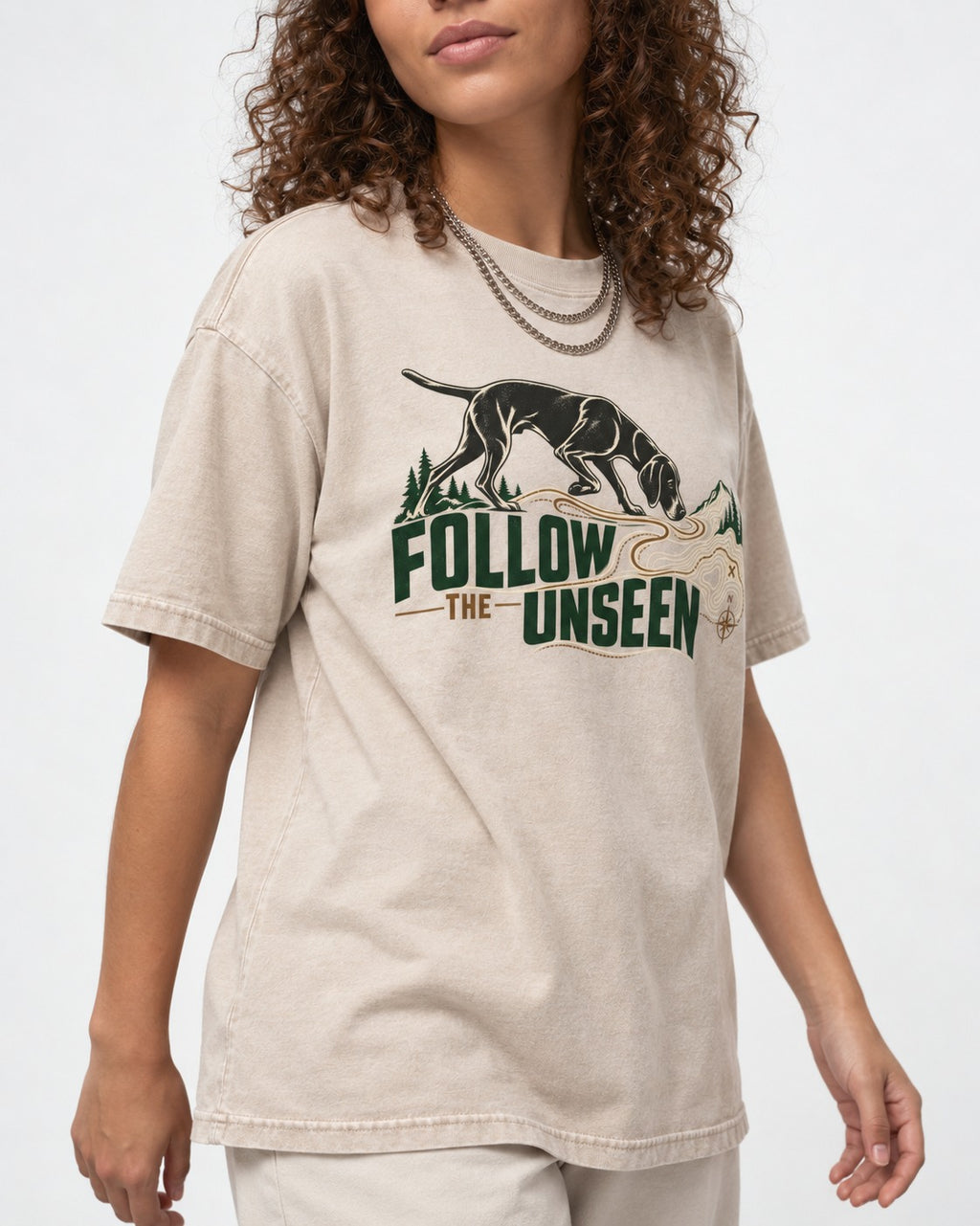 Follow the Unseen German Shorthaired Pointer Washed Tee in Apricot, worn by a model, front view