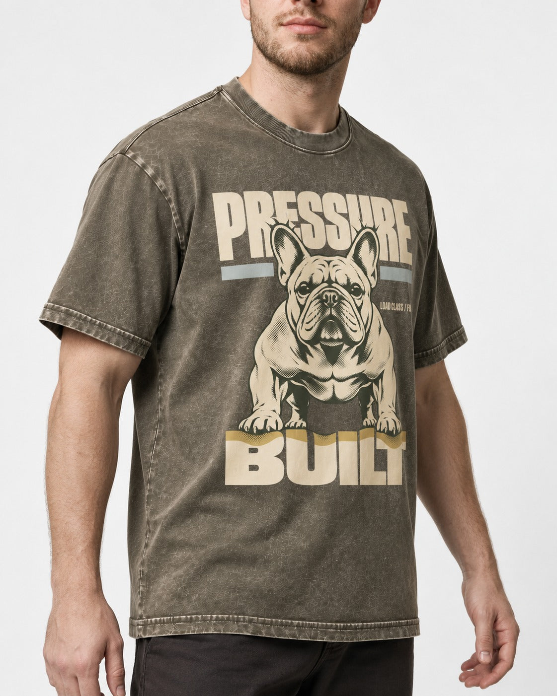 Frenchie Pressure Built Load Class Graphic Washed Tee in Army Green, worn by a model, front view