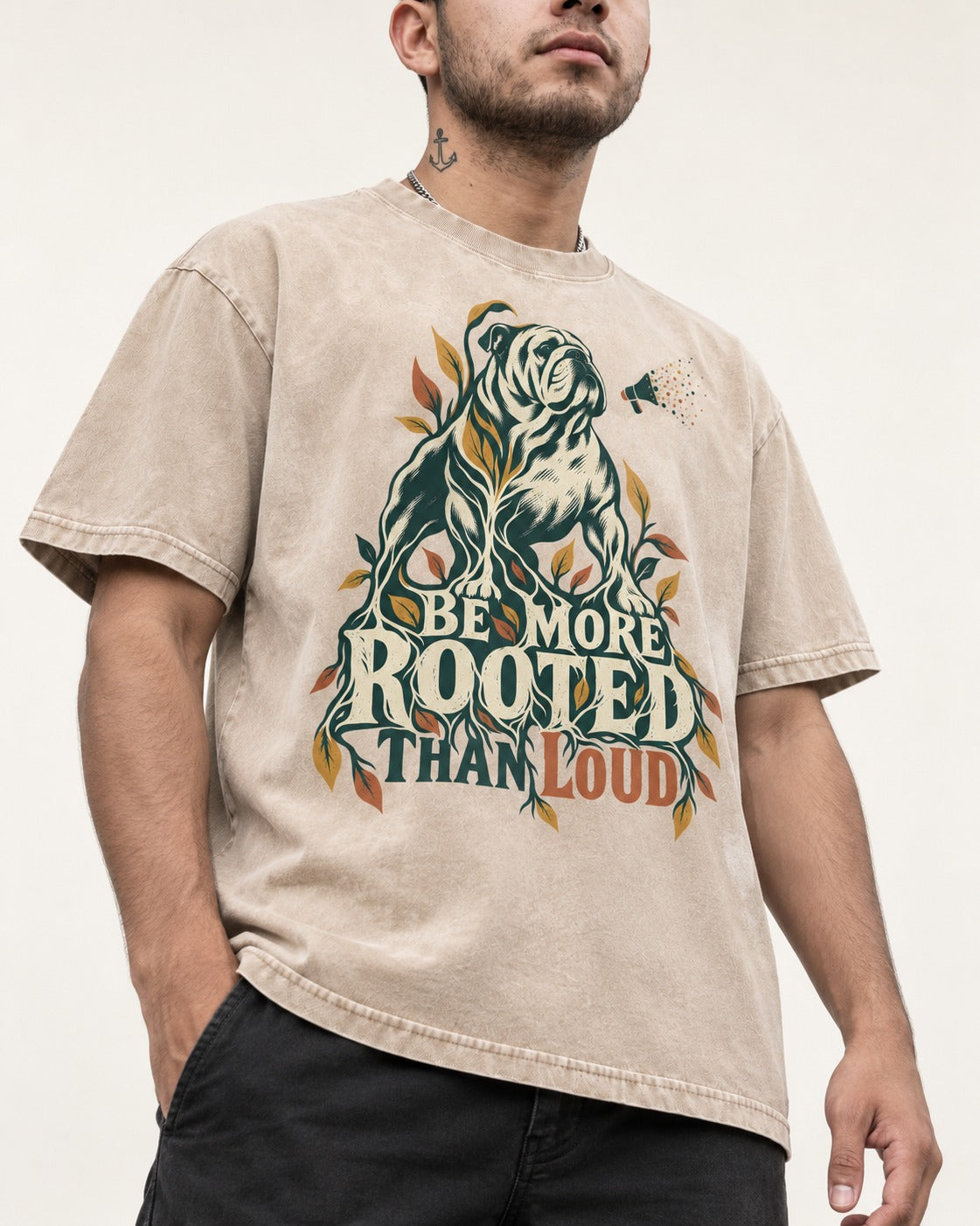 More Rooted Than Loud English Bulldog Washed Tee in Apricot, worn by a model, front view