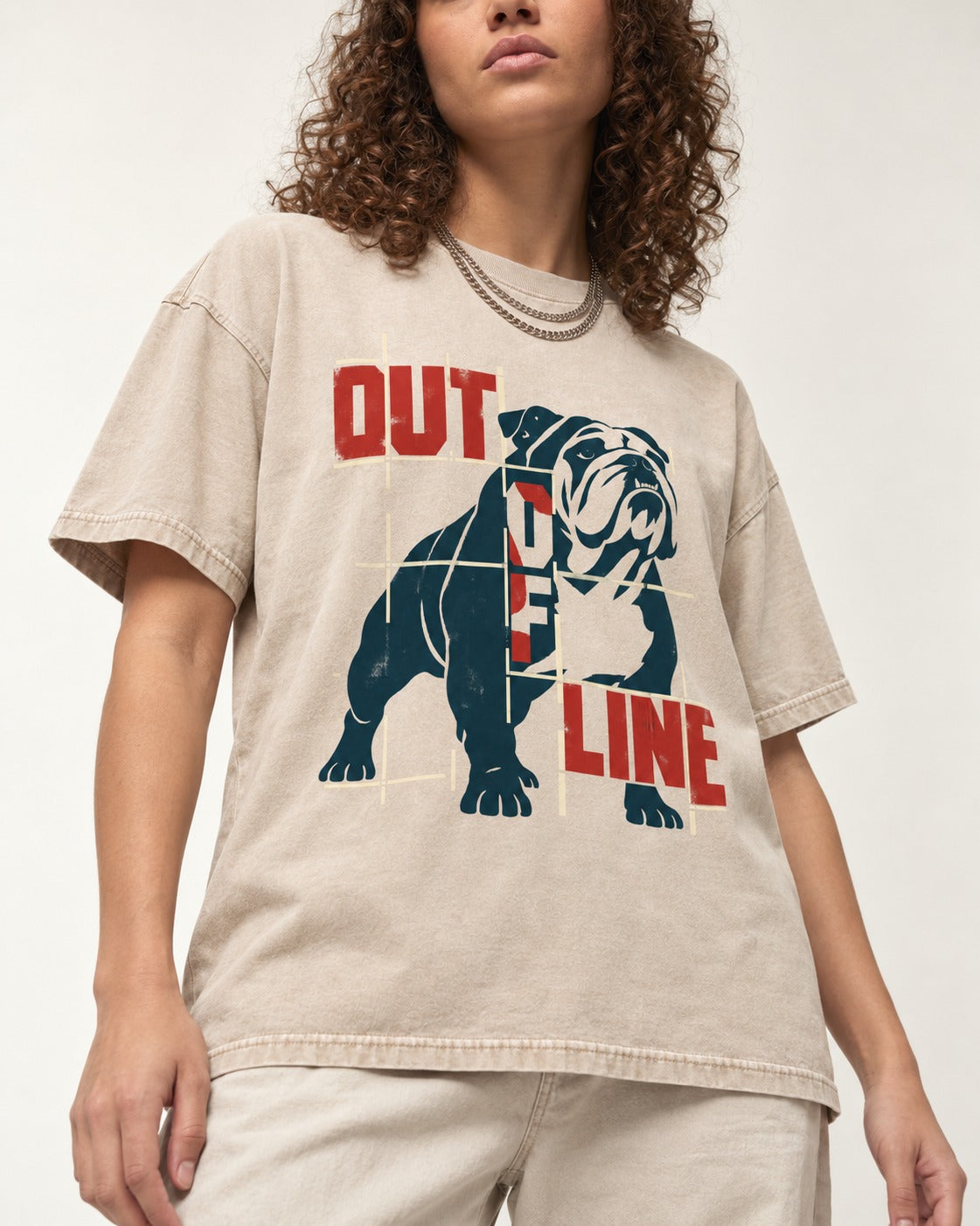 English Bulldog Out of Line Washed Tee in Apricot, worn by a model, front view