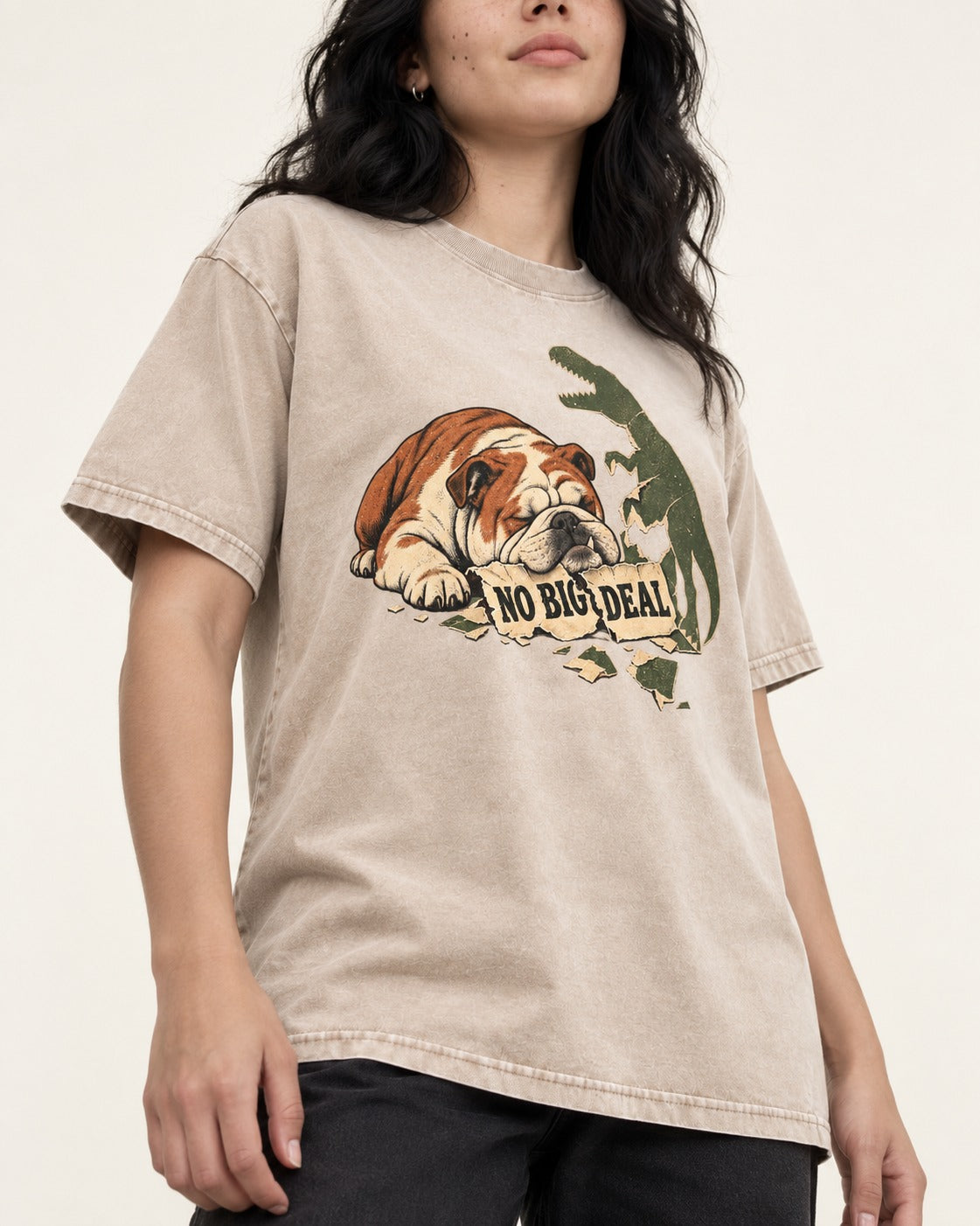 English Bulldog No Big Deal Dinosaur Graphic Washed Tee in Apricot, worn by a model, front view