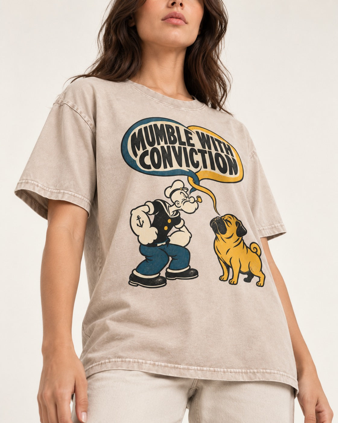 Pug Mumble with Conviction Washed Tee in Apricot, worn by a model, front view