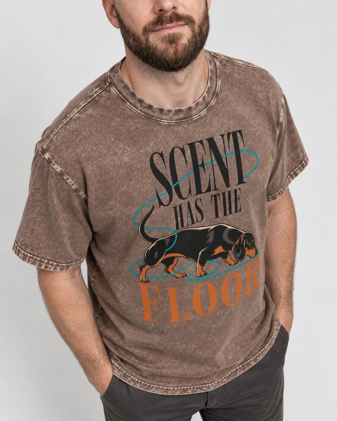 Dachshund Scent Has the Floor Washed Tee in Coffee, worn by a model, front view