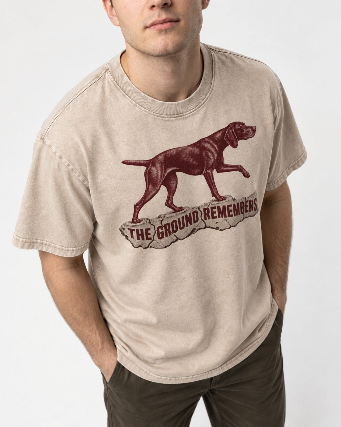 The Ground Remembers German Shorthaired Pointer Washed Tee in Apricot, worn by a model, front view