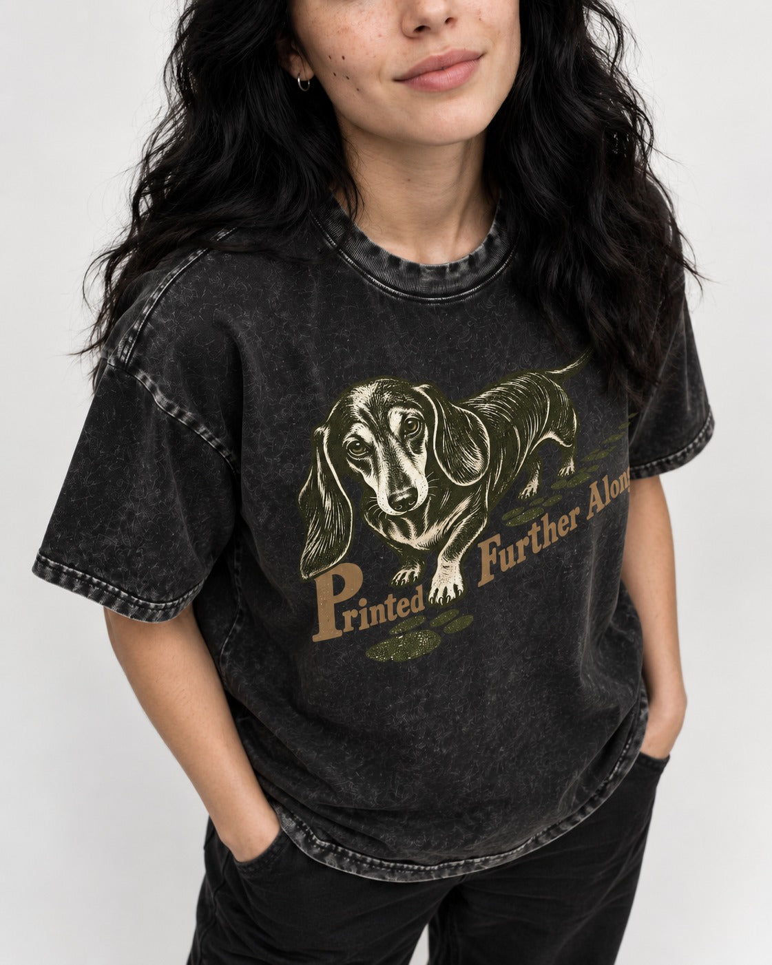 Dachshund Printed Further Along Footprint Graphic Washed Tee in Black, worn by a model, front view