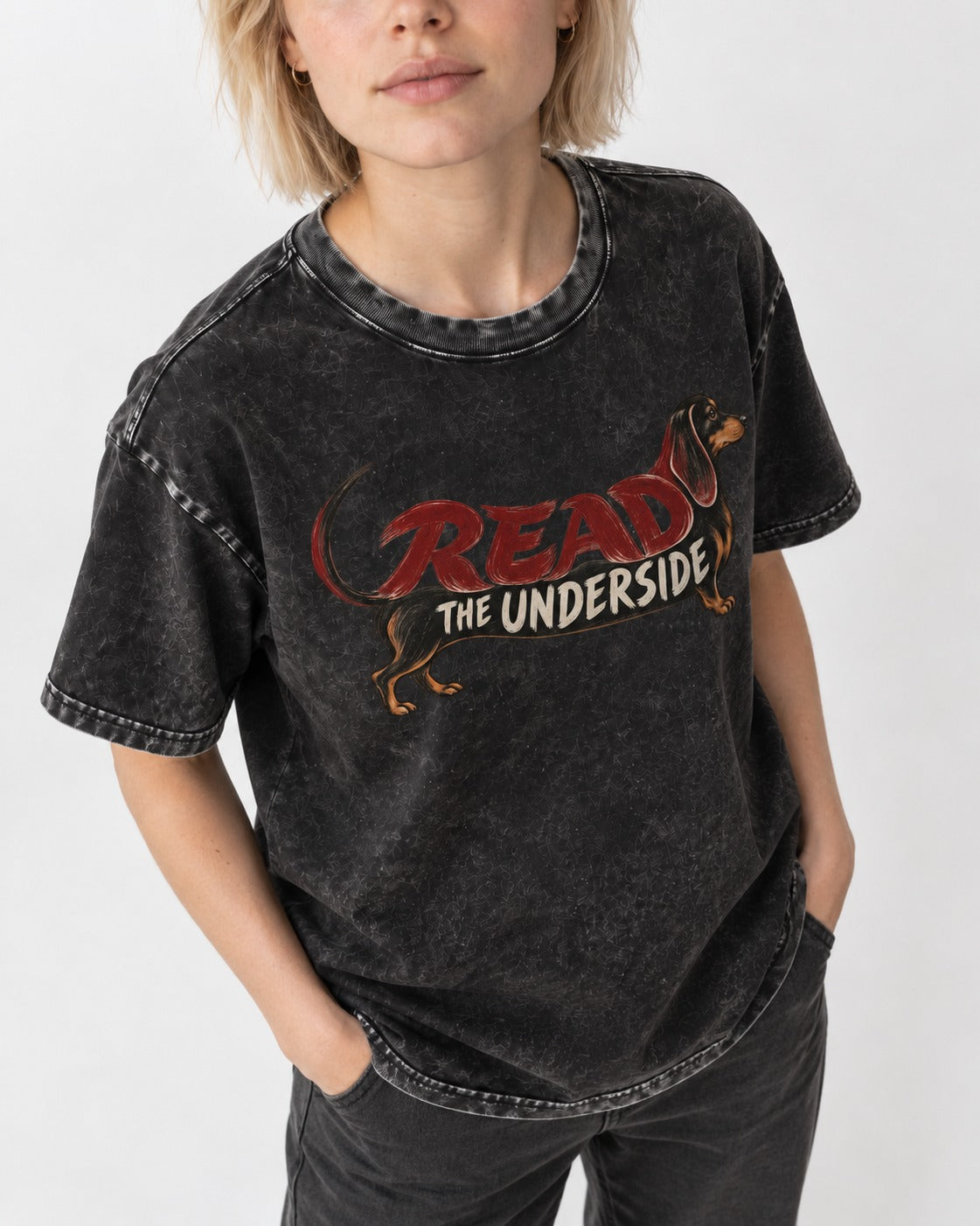 Dachshund Read The Underside Body Lettering Graphic Washed Tee in Black, worn by a model, front view