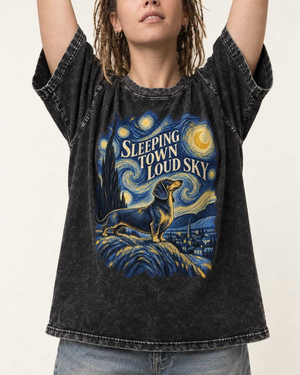 Dachshund Sleeping Town Loud Sky Starry Night Graphic Washed Tee in Black, worn by a model, front view