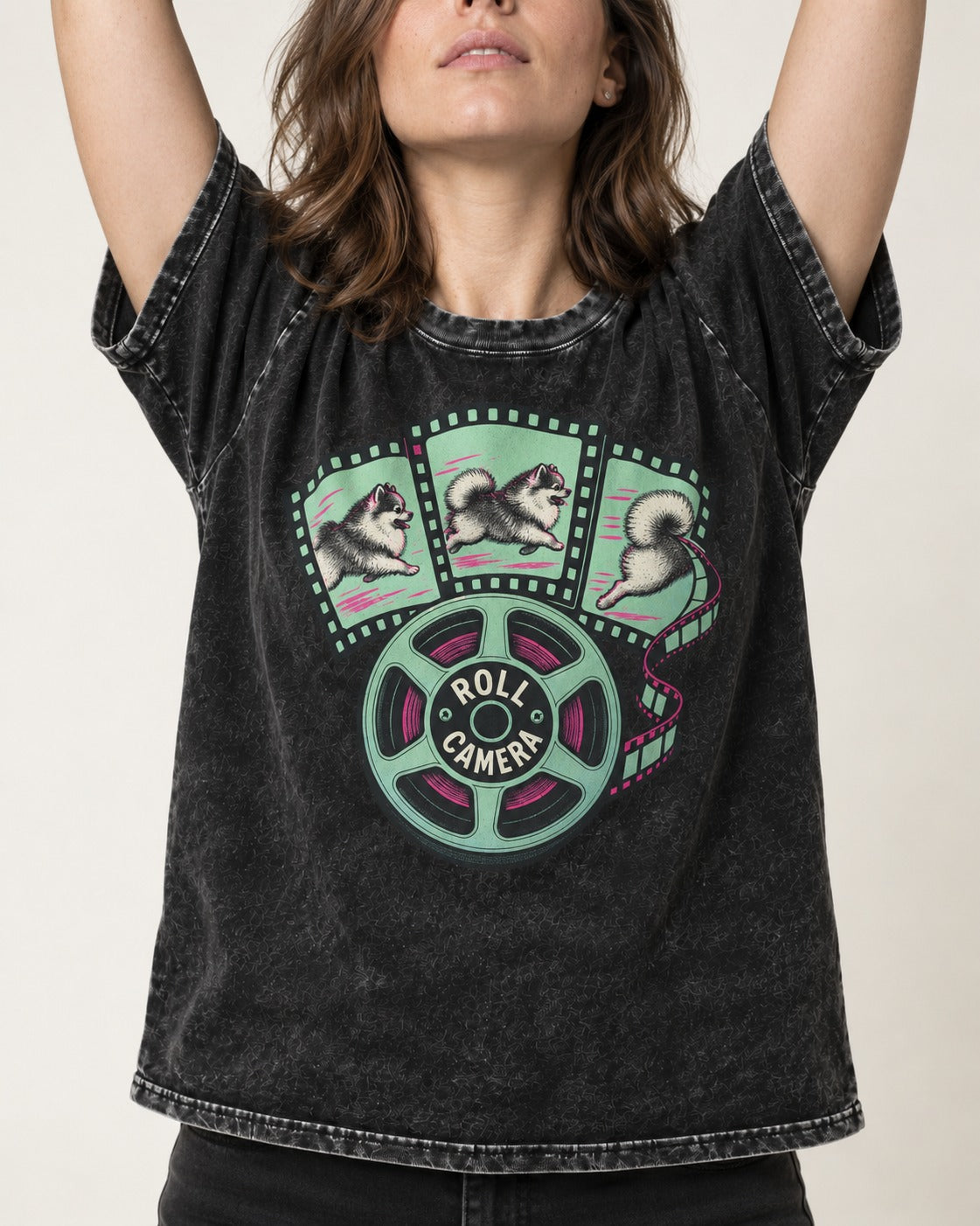 Pomeranian Roll Camera Film Reel Graphic Washed Tee in Black, worn by a model, front view