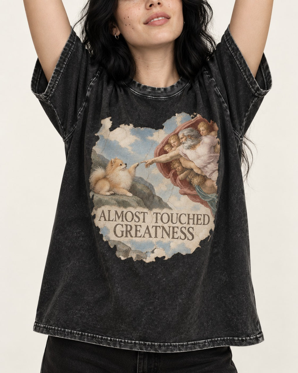 Pomeranian Almost Touched Greatness Fresco Graphic Washed Tee in Black, worn by a model, front view