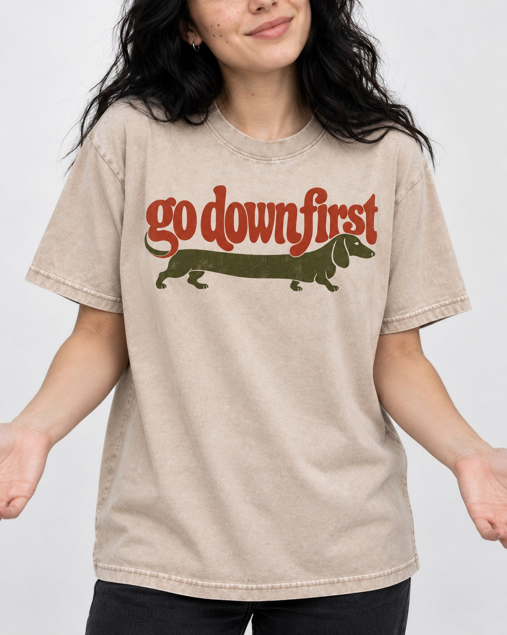 Dachshund Goes Down First Washed Tee in Apricot, worn by a model, front view