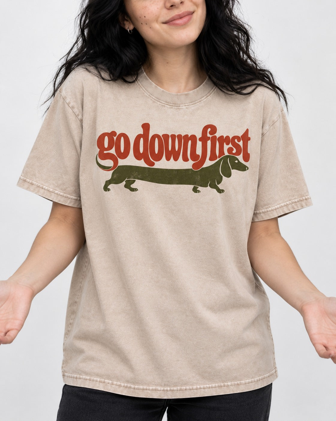 Dachshund Goes Down First Washed Tee in Apricot, worn by a model, front view