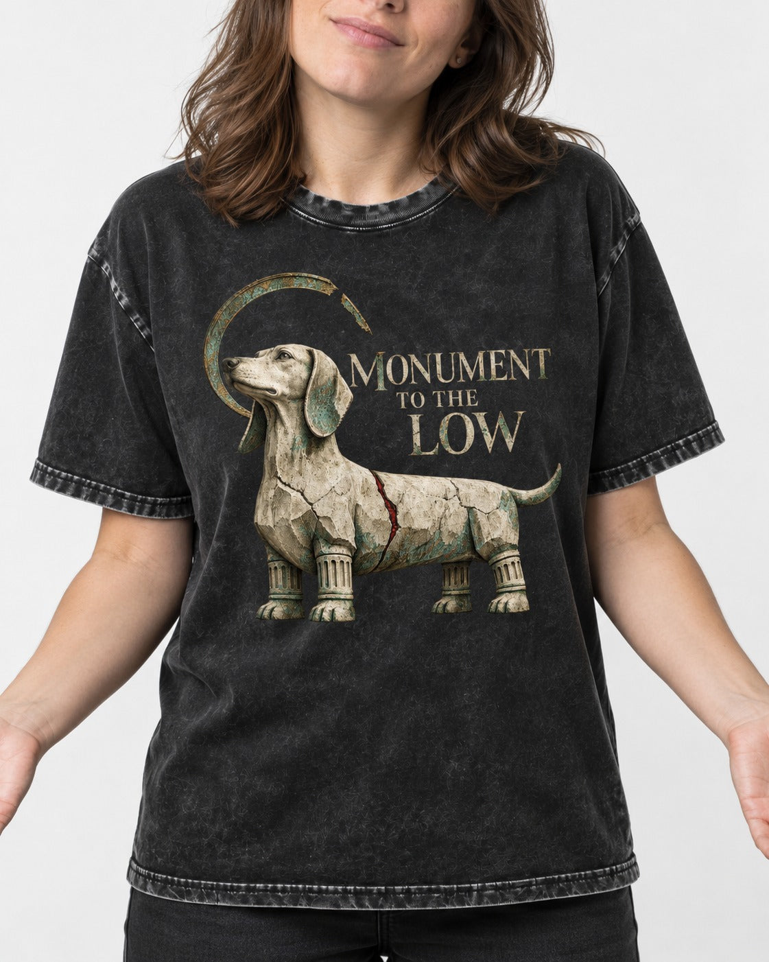 Dachshund Monument to the Low Stone Statue Graphic Washed Tee in Black, worn by a model, front view