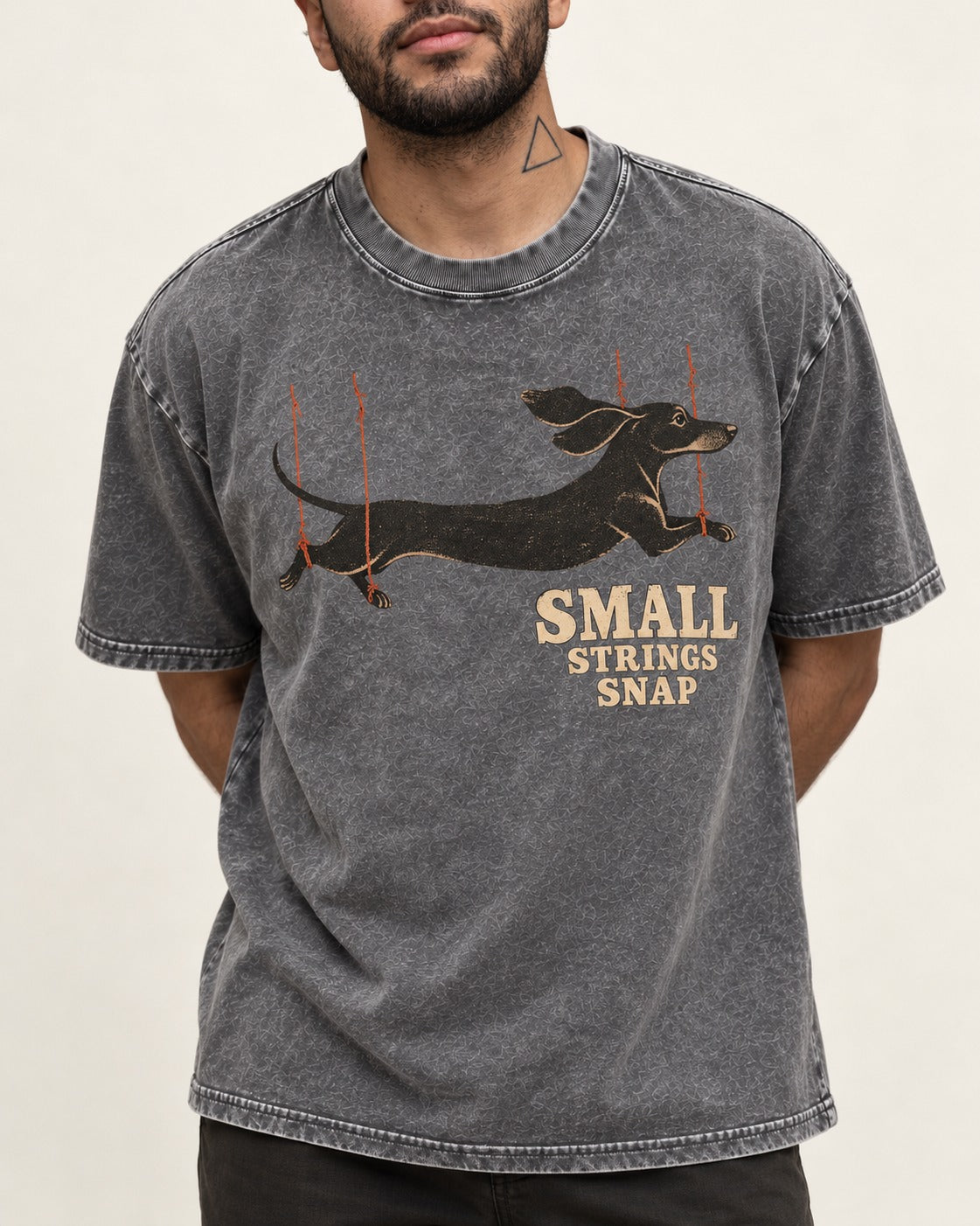 Dachshund Small Strings Snap Marionette Graphic Washed Tee in Gray, worn by a model, front view