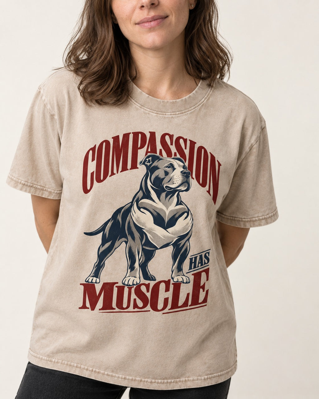 Pitbull Compassion Has Muscle Washed Tee in Apricot, worn by a model, front view