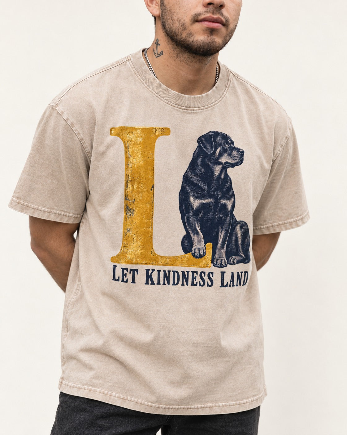 Let Kindness Lead Rottweiler Washed Tee in Apricot, worn by a model, front view