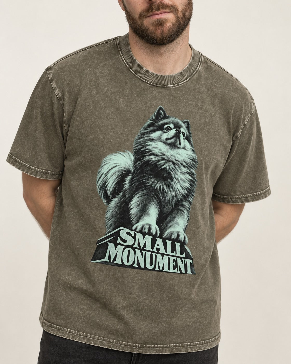 Pomeranian Small Monument Pedestal Graphic Washed Tee in Army Green, worn by a model, front view
