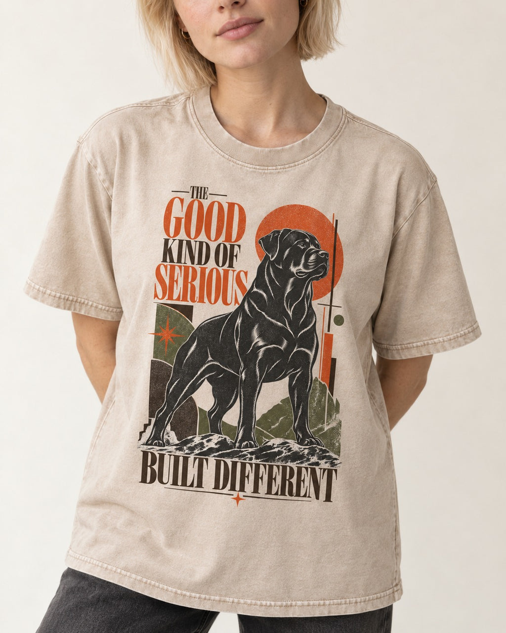 Rottweiler Built Different Washed Tee in Apricot, worn by a model, front view