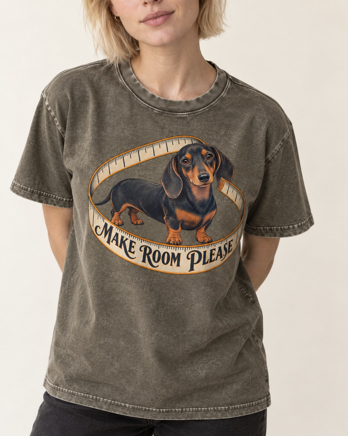 Dachshund Make Room Please Measuring Tape Graphic Washed Tee in Army Green, worn by a model, front view