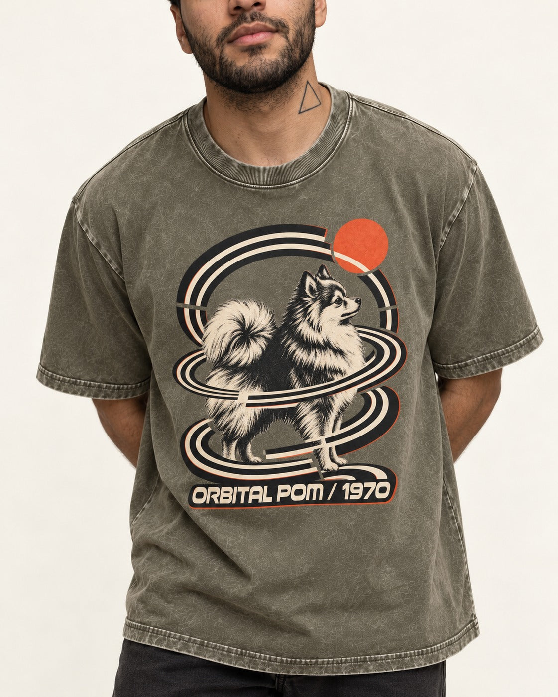 Pomeranian Orbital Pom 1970 Space Age Graphic Washed Tee in Army Green, worn by a model, front view