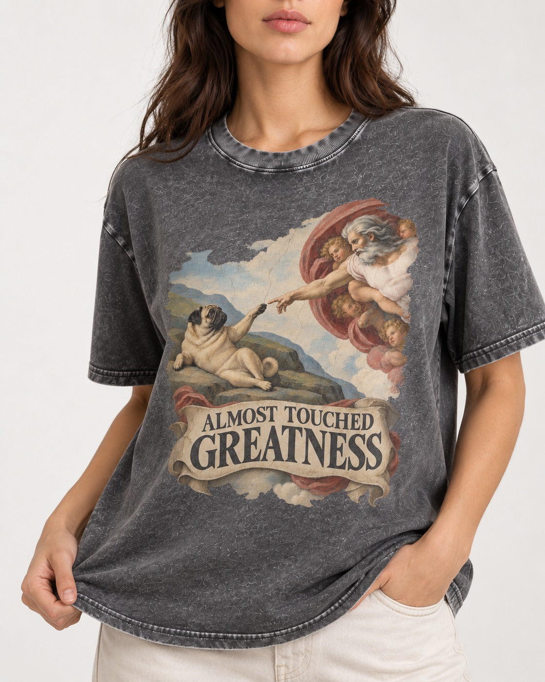 Pug Almost Touched Greatness Creation Parody Graphic Washed Tee in Gray, worn by a model, front view