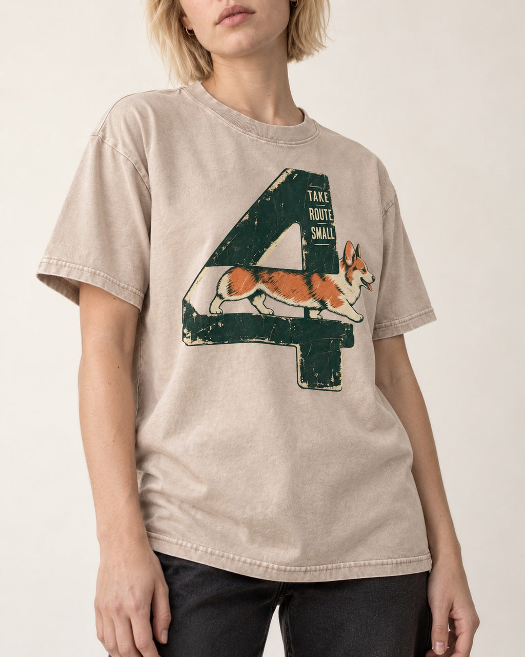 Take Route Small Corgi Washed Tee in Apricot, worn by a model, front view