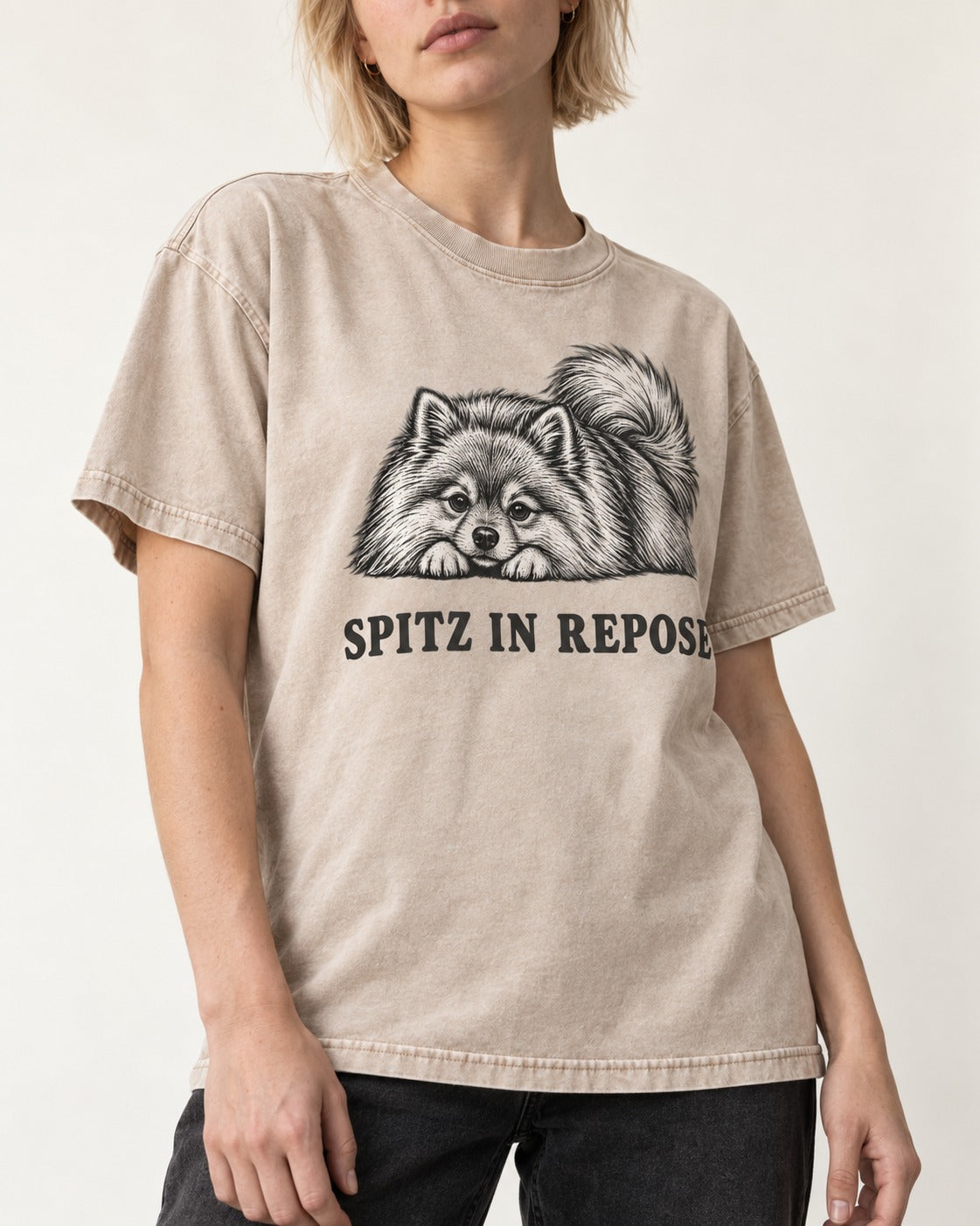 Pomeranian In Repose Washed Tee in Apricot, worn by a model, front view