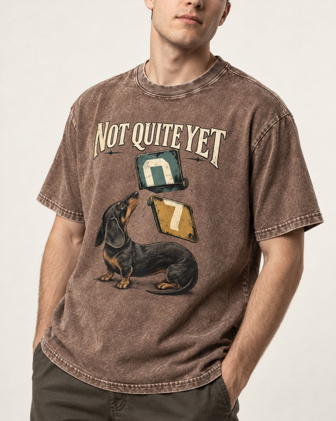 Not Quite Yet Dachshund Washed Tee in Coffee, worn by a model, front view