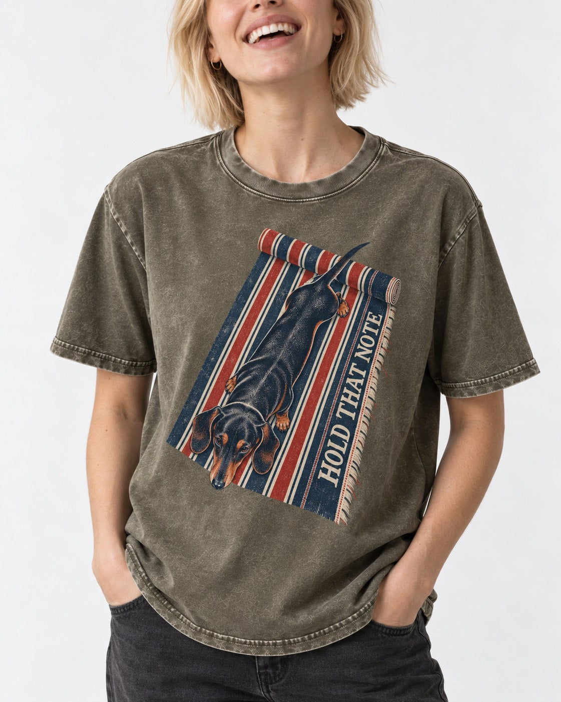 Dachshund Hold That Note Striped Rug Graphic Washed Tee in Army Green, worn by a model, front view