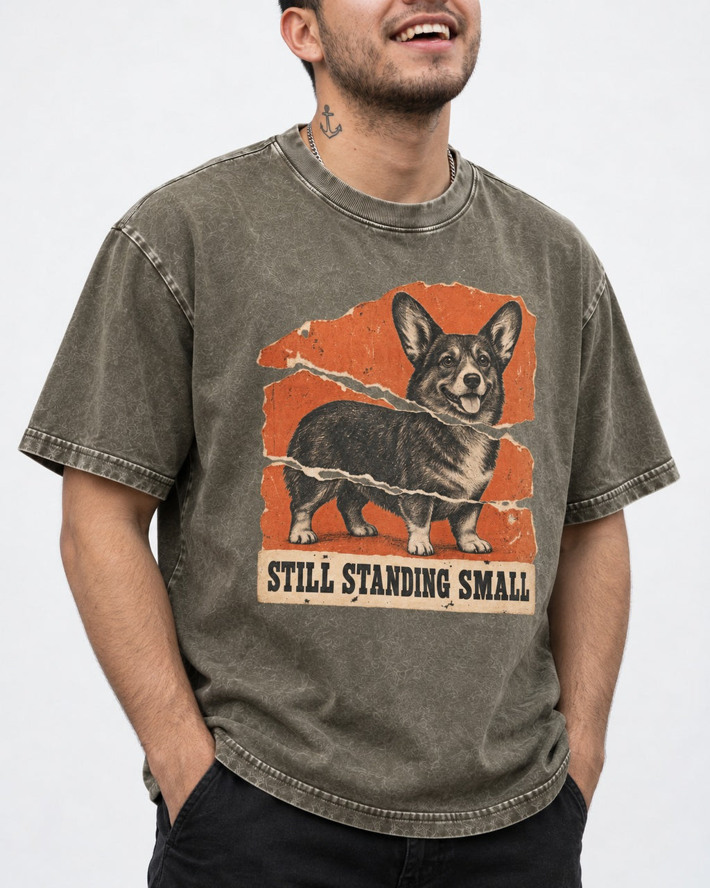 Corgi Still Standing Small Torn Poster Washed Tee in Army Green, worn by a model, front view