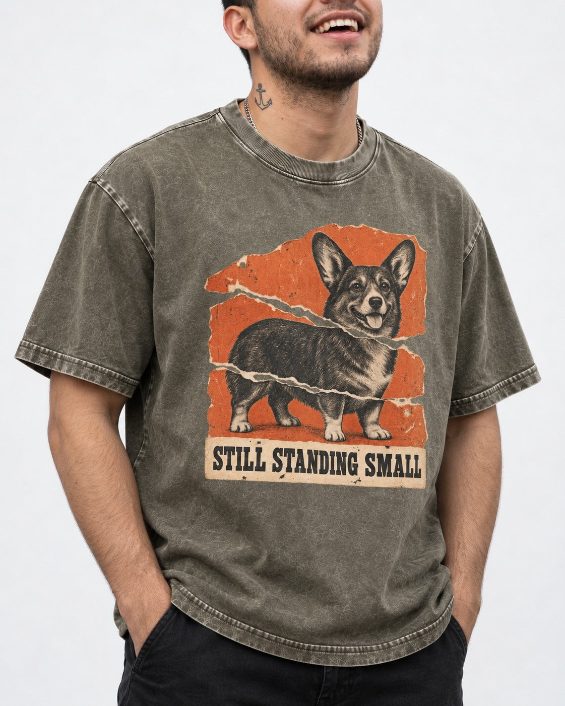 Corgi Still Standing Small Torn Poster Washed Tee in Army Green, worn by a model, front view
