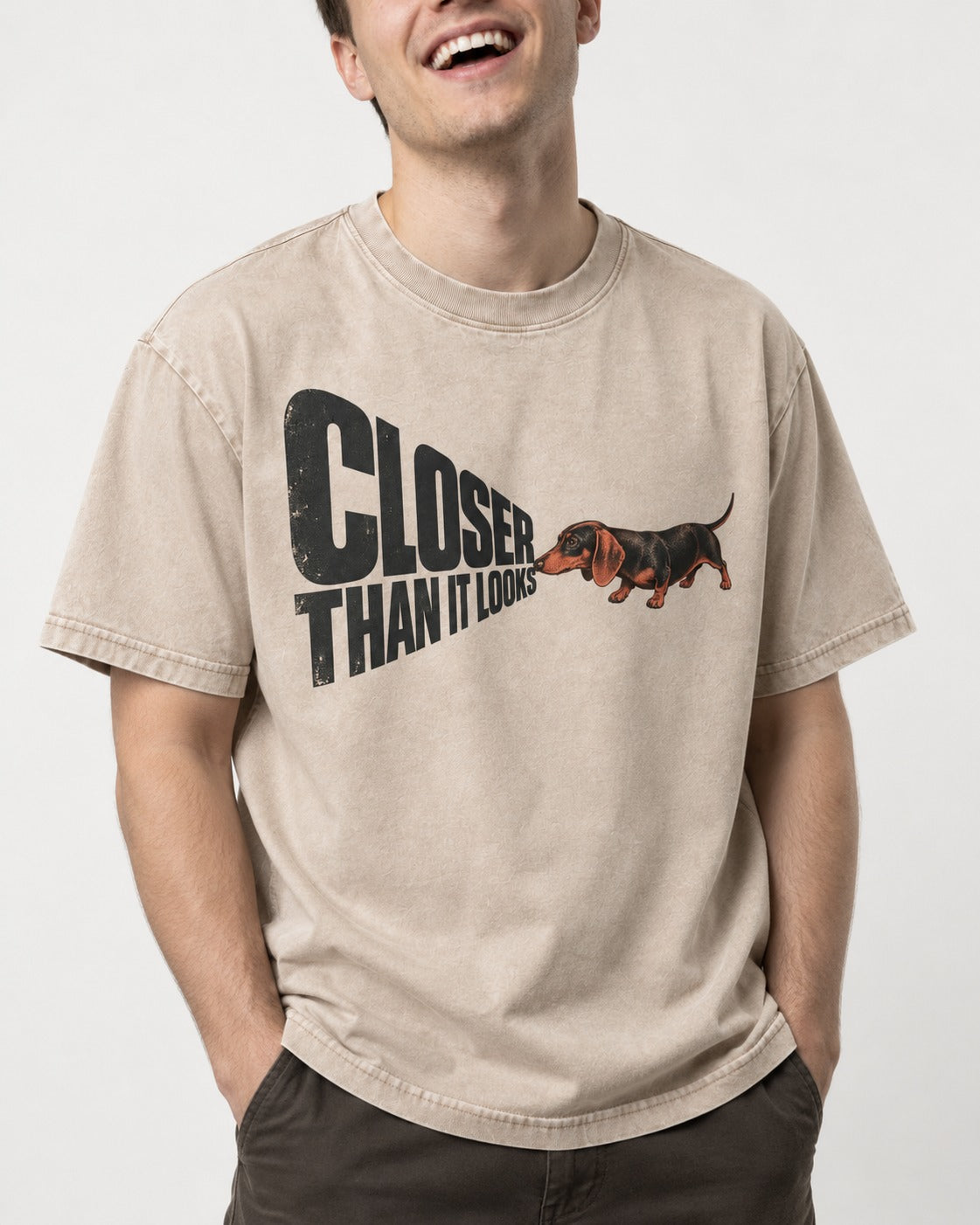 Dachshund Closer Than It Looks Washed Tee in Apricot, worn by a model, front view