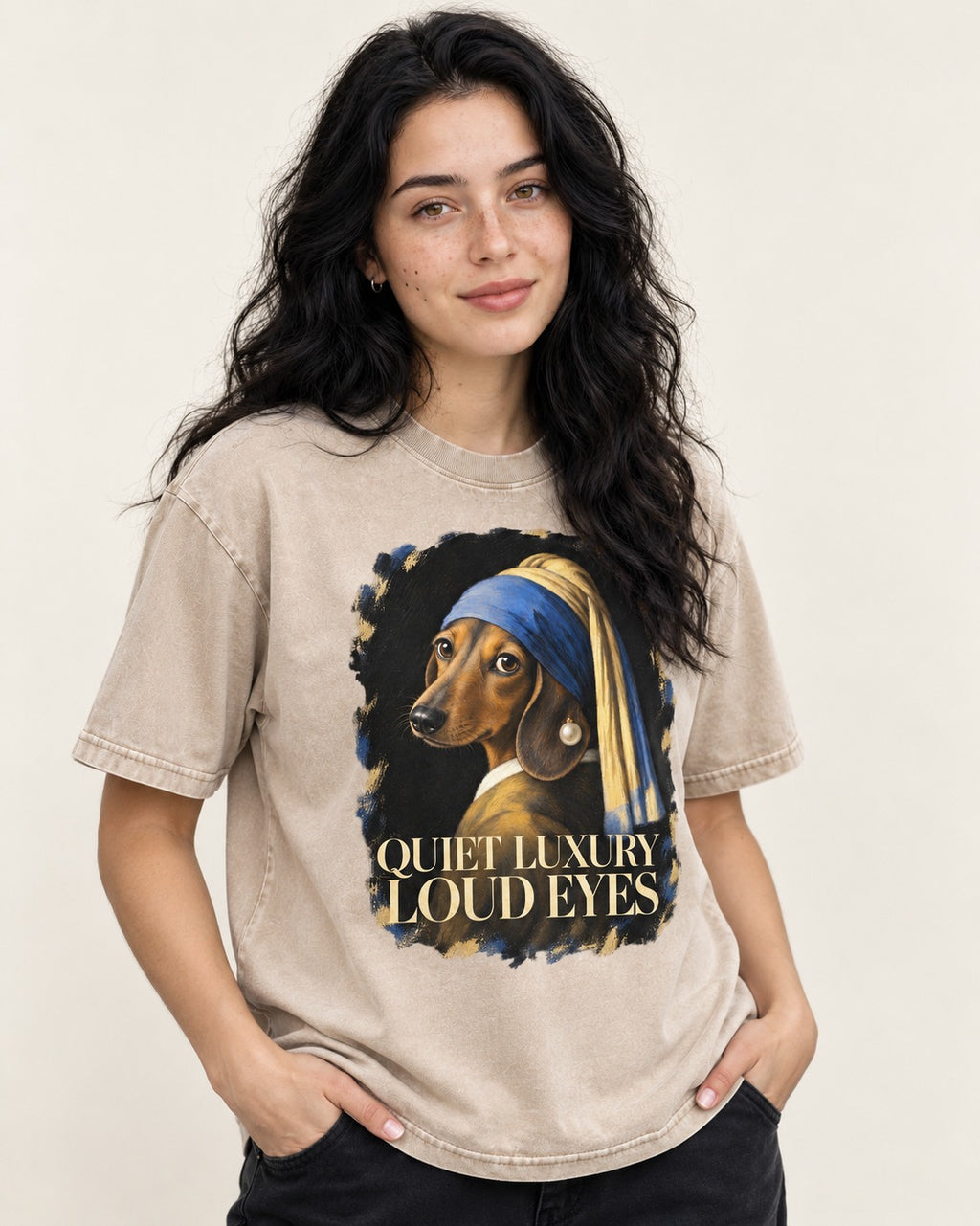 Dachshund Quiet Luxury Loud Eyes Pearl Portrait Graphic Washed Tee in Apricot, worn by a model