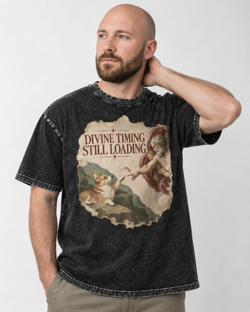 Corgi Divine Timing Still Loading Creation Parody Washed Tee in Black, worn by a model