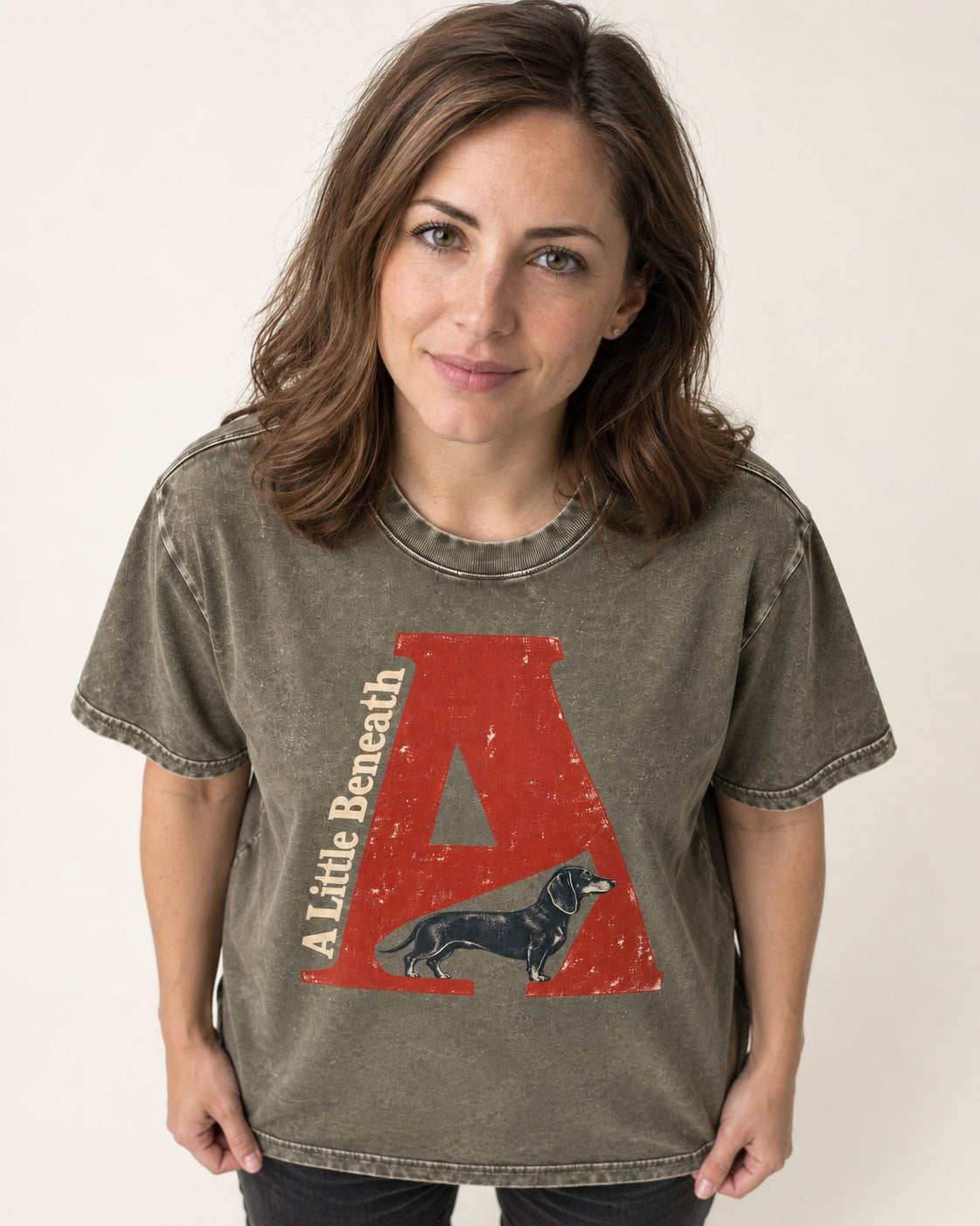 Dachshund A Little Beneath Monumental Letter Graphic Washed Tee in Army Green, worn by a model