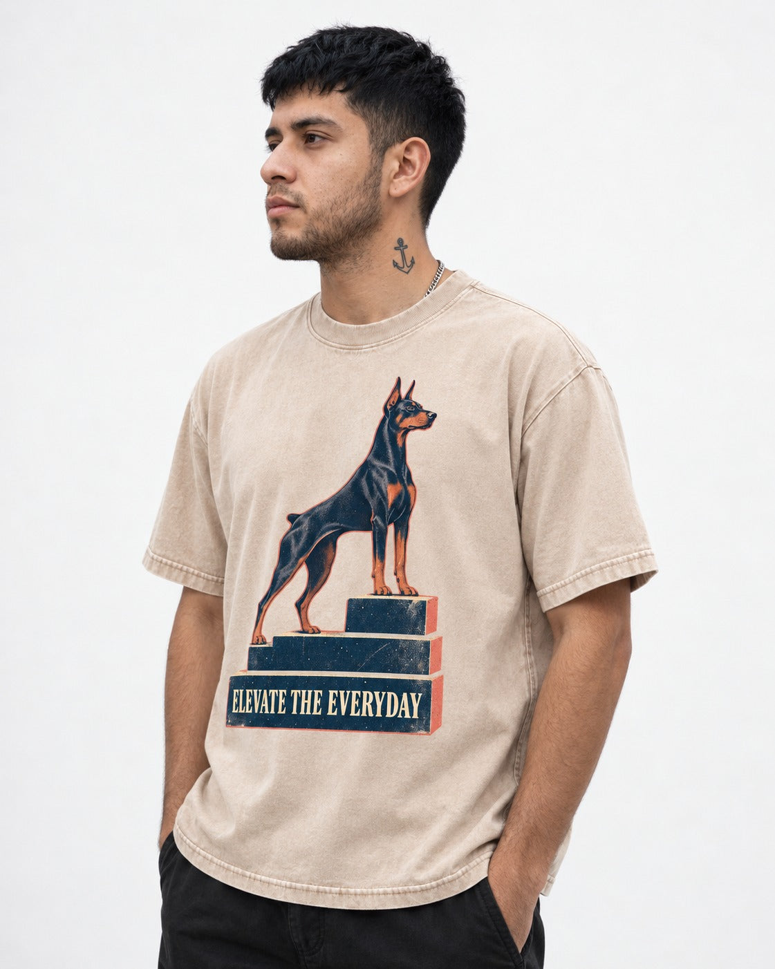 Doberman Elevate the Everyday Podium Graphic Washed Tee in Apricot, worn by a model