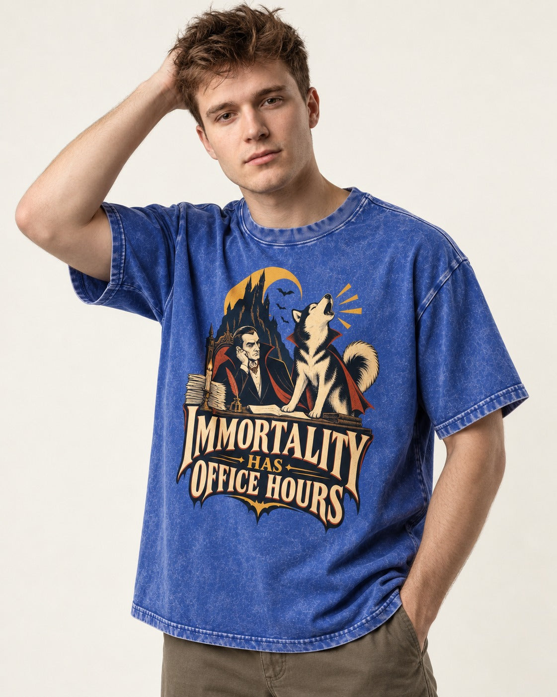 Husky Immortality Has Office Hours Vampire Office Graphic Washed Tee in Royal Blue, worn by a model