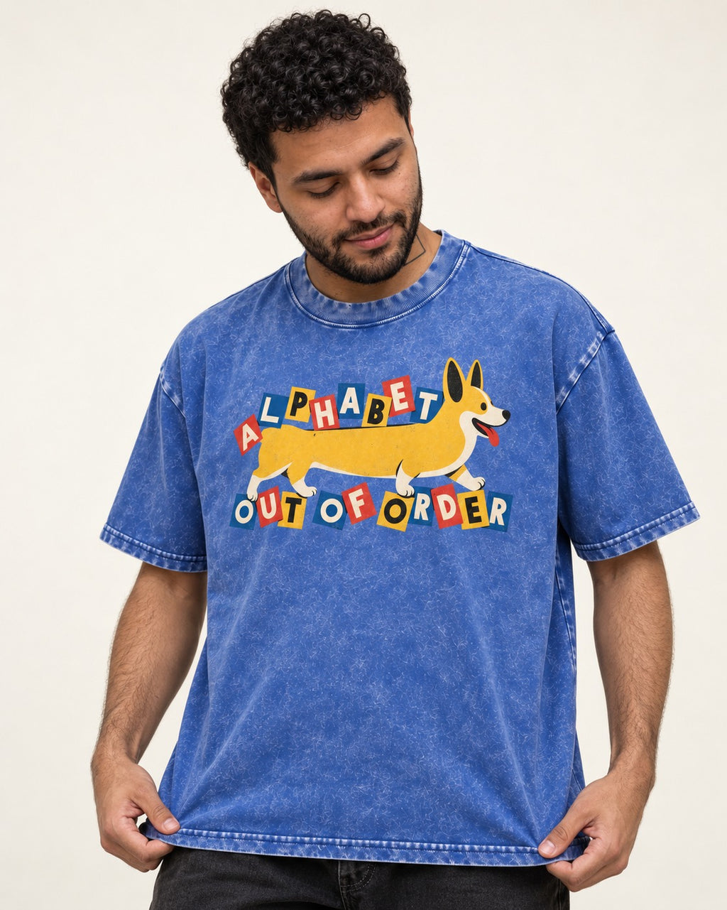 Corgi Alphabet Out of Order Graphic Washed Tee in Royal Blue, worn by a model
