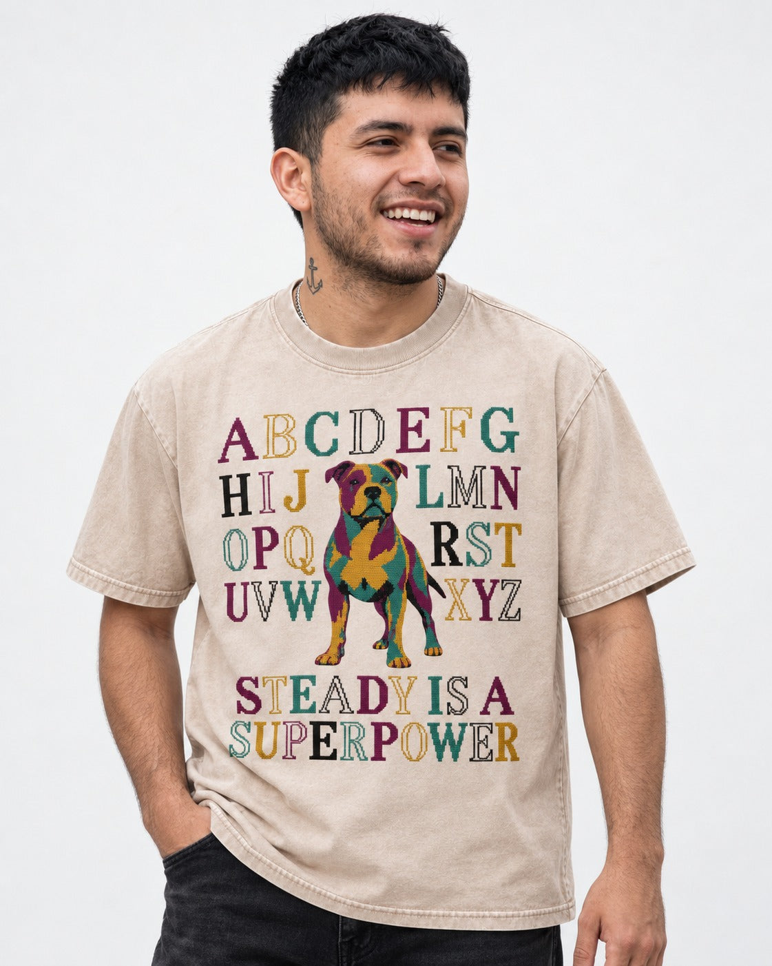 Pitbull Steady Is a Superpower Alphabet Graphic Washed Tee in Apricot, worn by a model