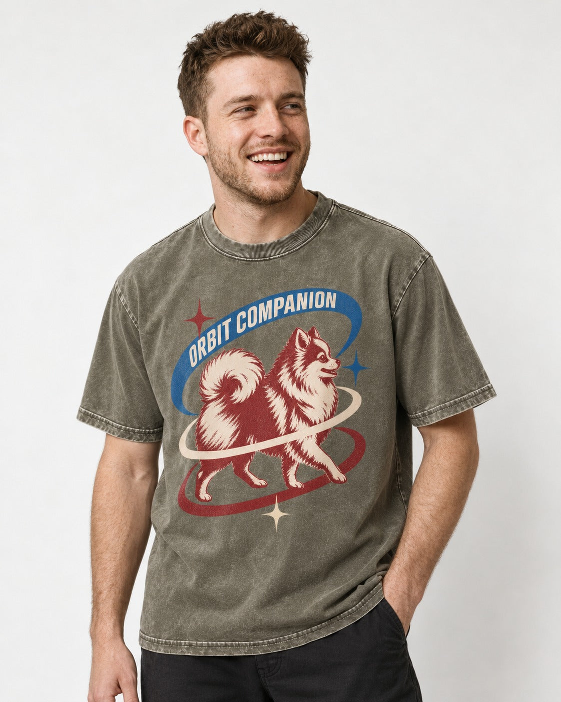 Pomeranian Orbit Companion Retro Space Graphic Washed Tee in Army Green, worn by a model