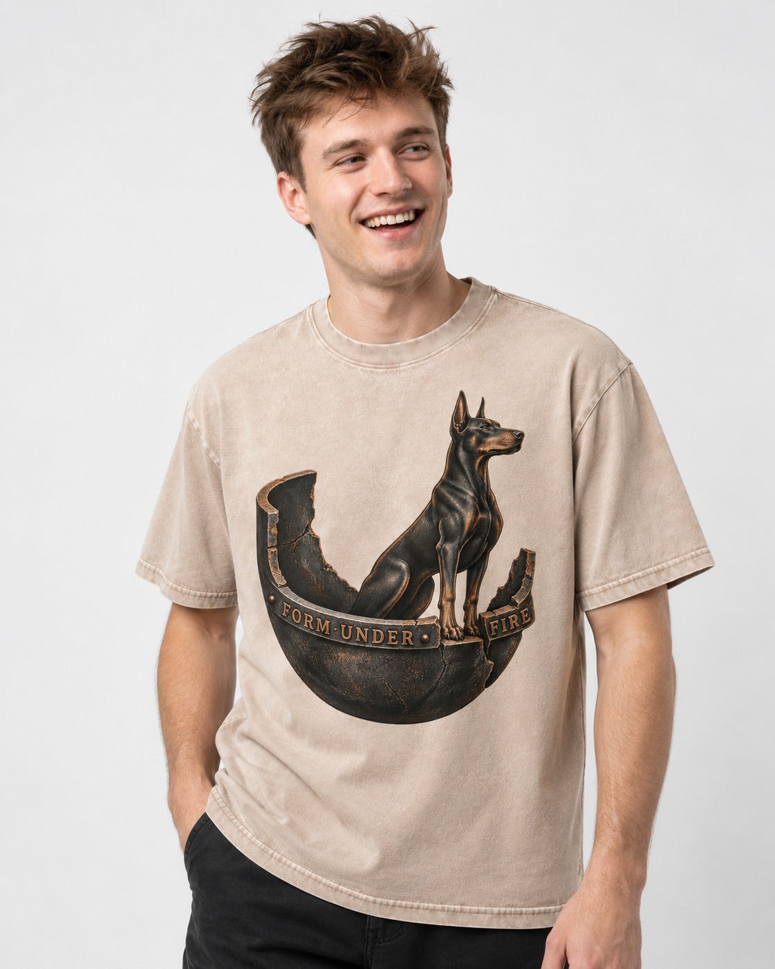 Doberman Form Under Fire Broken Shell Graphic Washed Tee in Apricot, worn by a model