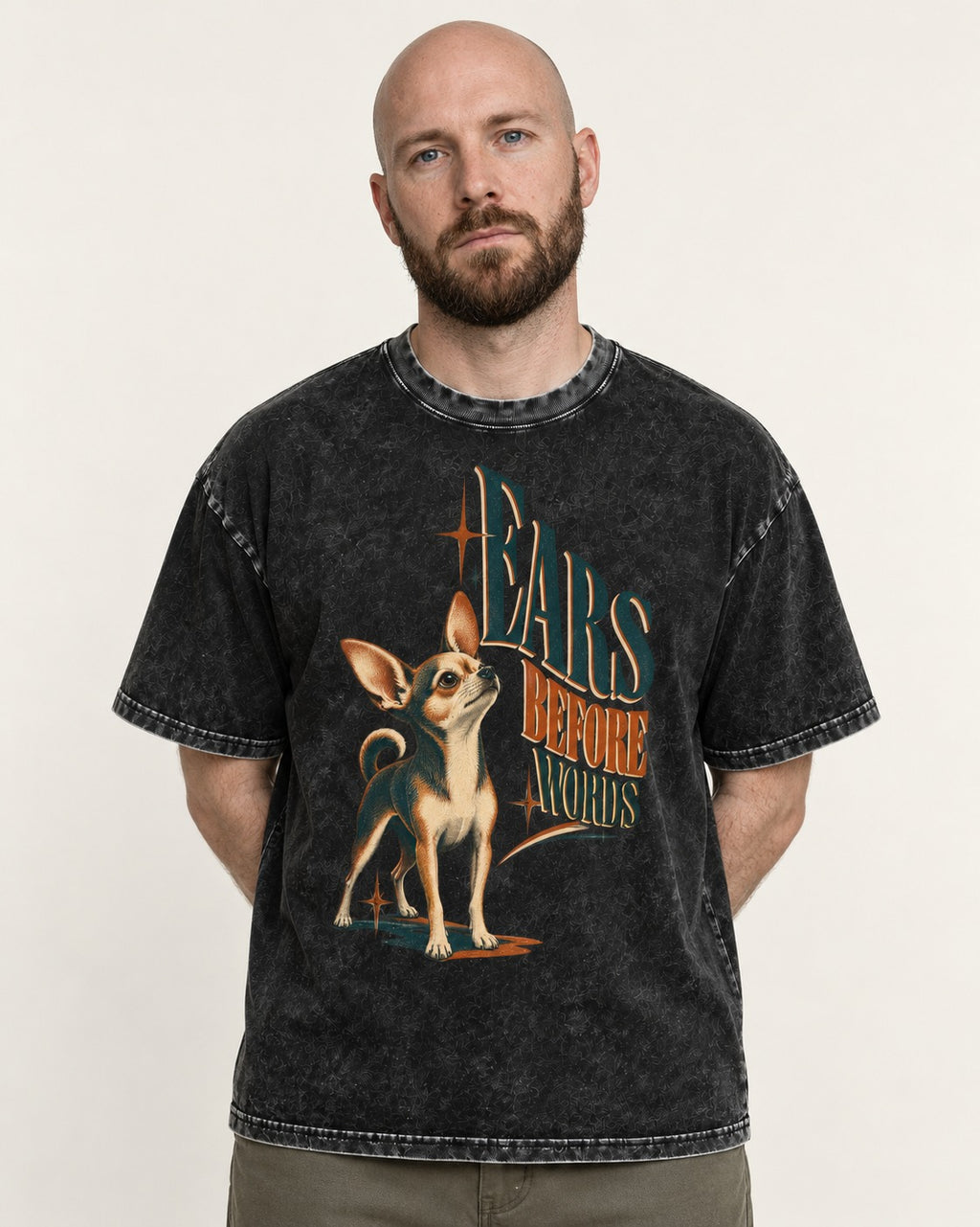 Chihuahua Ears Before Words Retro Typography Washed Tee in Black, worn by a model