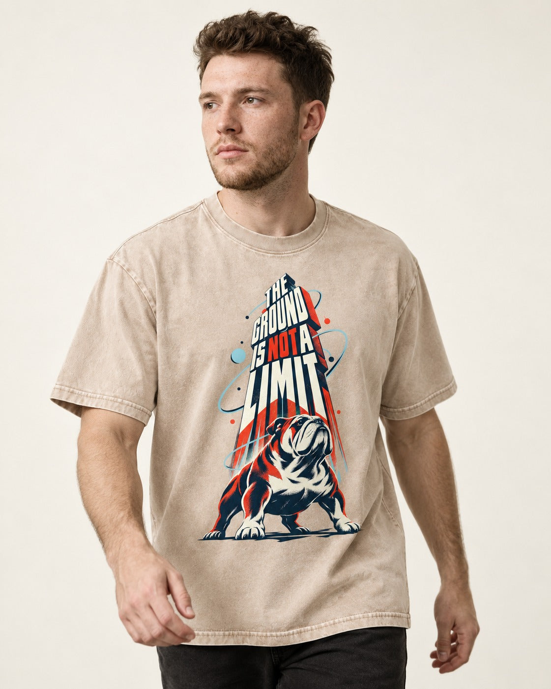 English Bulldog The Ground Is Not a Limit Orbital Graphic Washed Tee in Apricot, worn by a model
