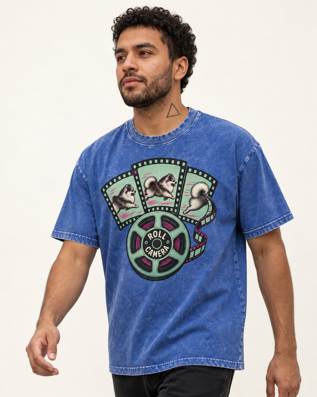 Pomeranian Roll Camera Film Reel Graphic Washed Tee in Royal Blue, worn by a model