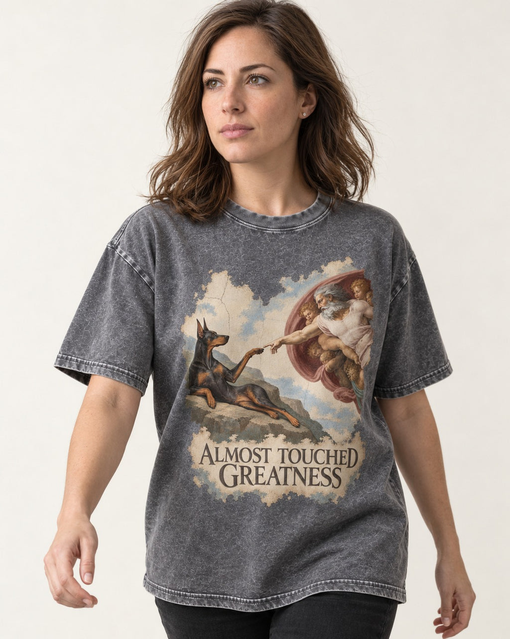 Doberman Almost Touched Greatness Creation Scene Graphic Washed Tee in Gray, worn by a model