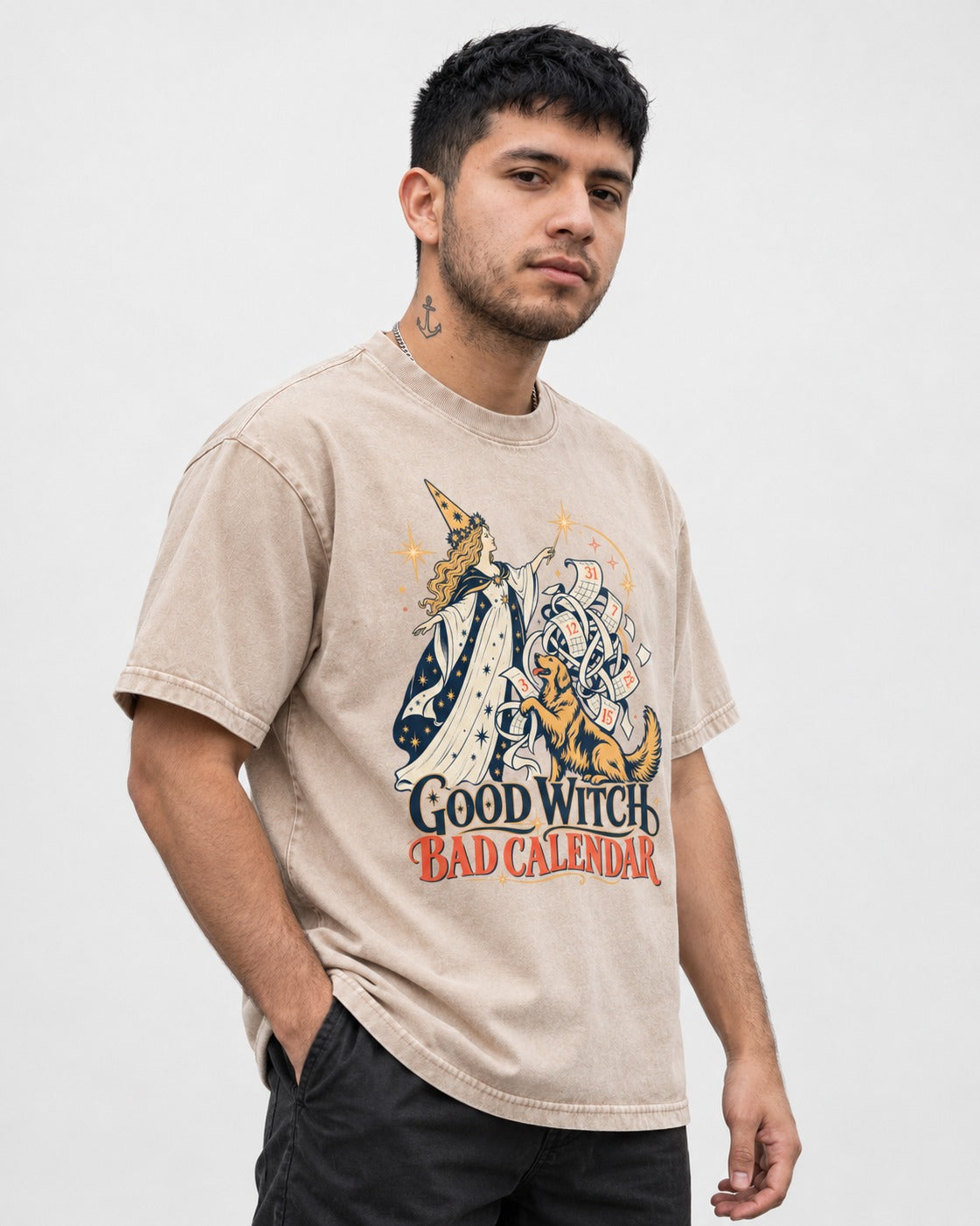 Good Witch Bad Calendar Golden Retriever Washed Tee in Apricot, worn by a model