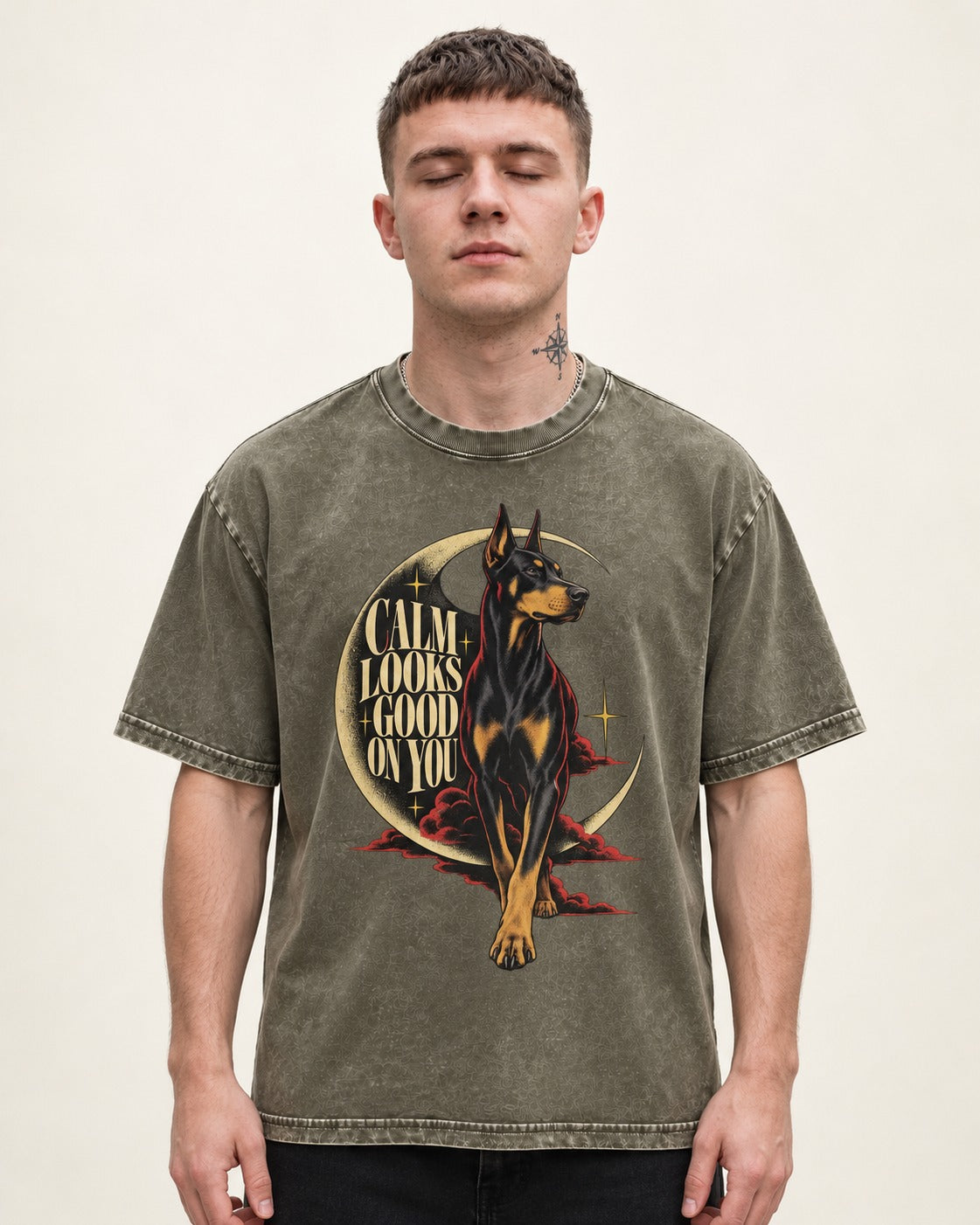 Doberman Calm Looks Good on You Crescent Graphic Washed Tee in Army Green, worn by a model