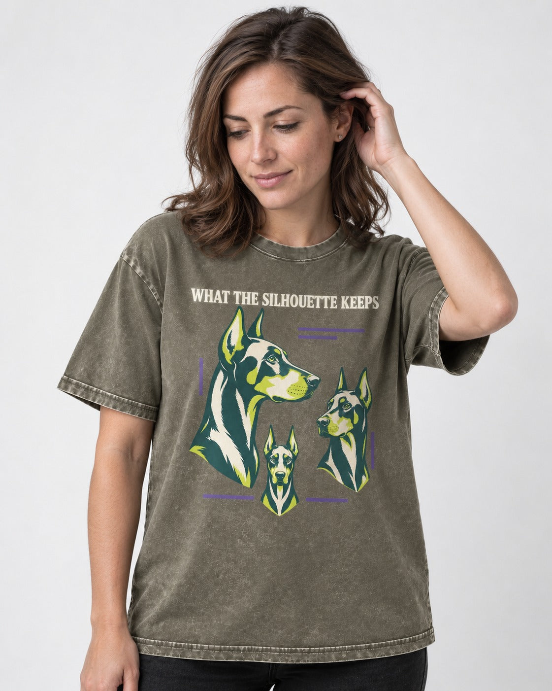 Doberman What the Silhouette Keeps Three Portrait Graphic Washed Tee in Army Green, worn by a model
